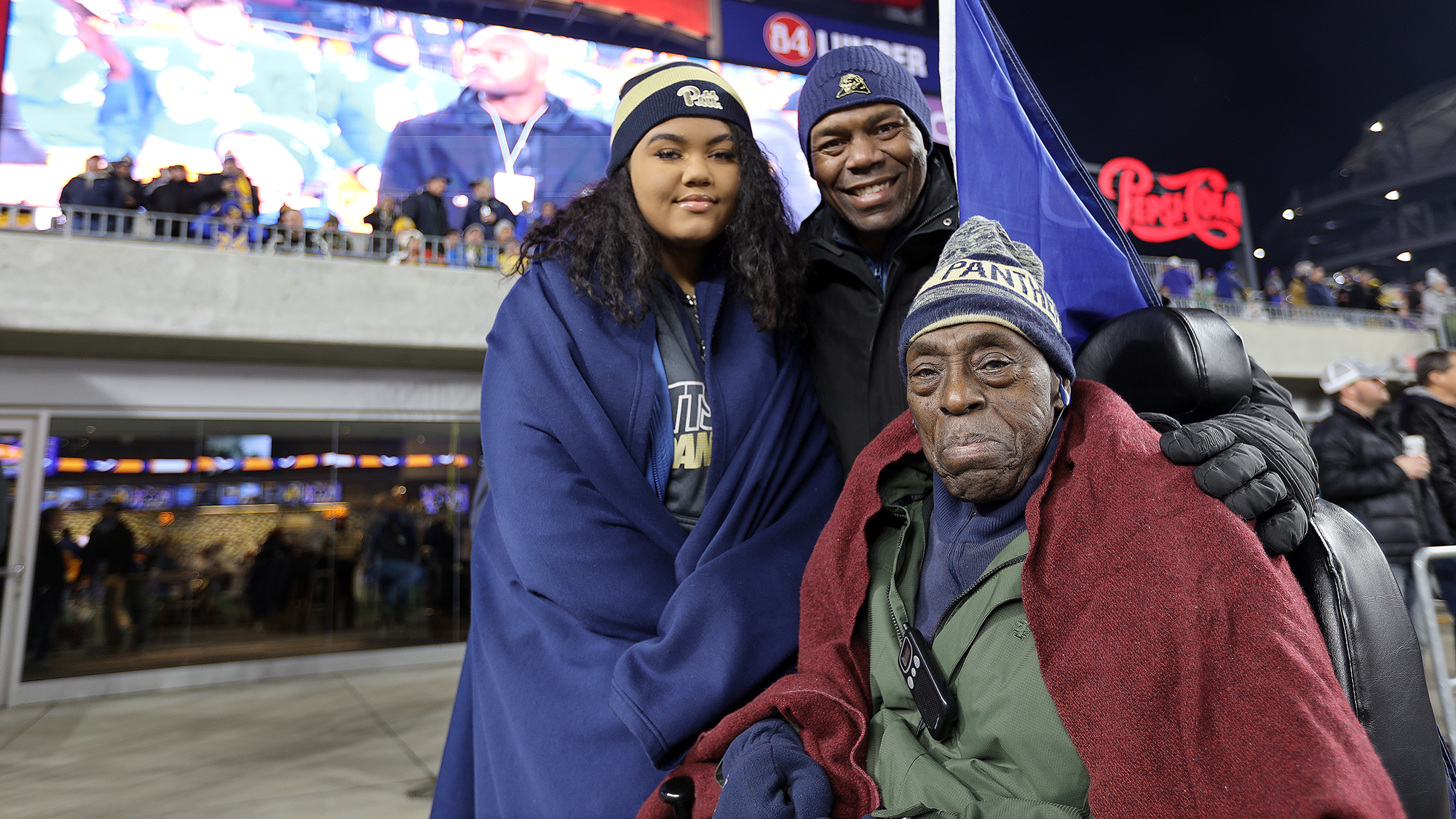 Camille, Rob Jr. and Rob Grier Sr. attend a Penn State football game. Rob Sr. broke the color barrier at the Sugar Bowl when he played for the team. VINO WONG/SKY BLOSSOM FILMS